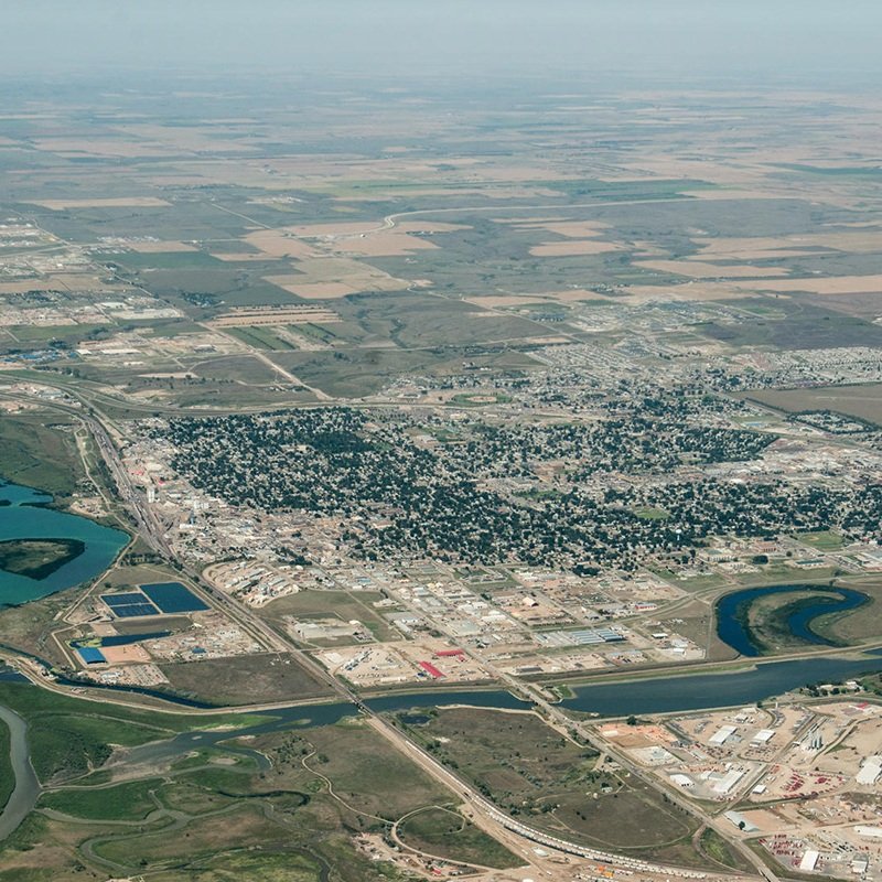 Investor reviewing commercial development site options with broker in growing Williston business corridor