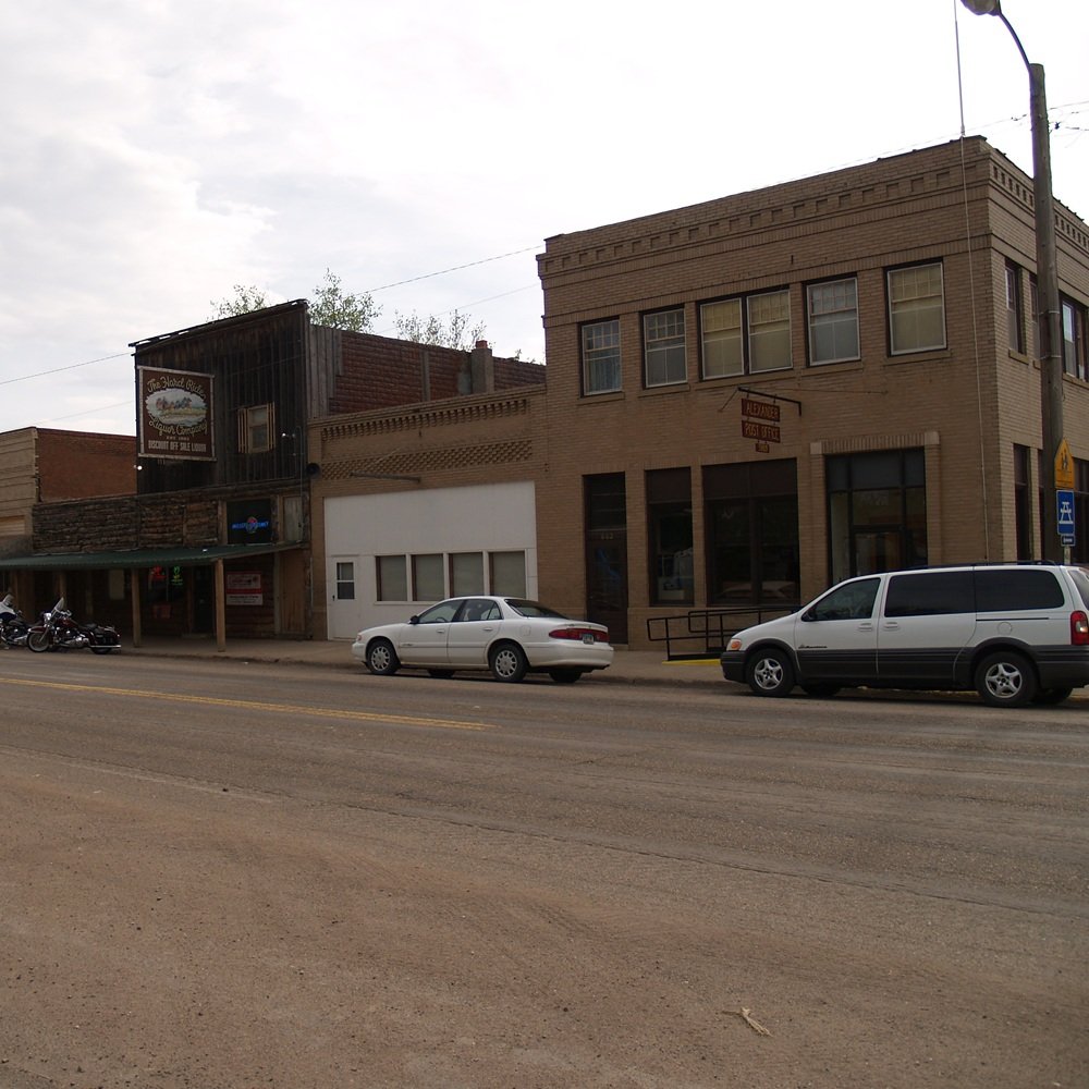 Industrial broker reviewing yard and warehouse options with business owner on site