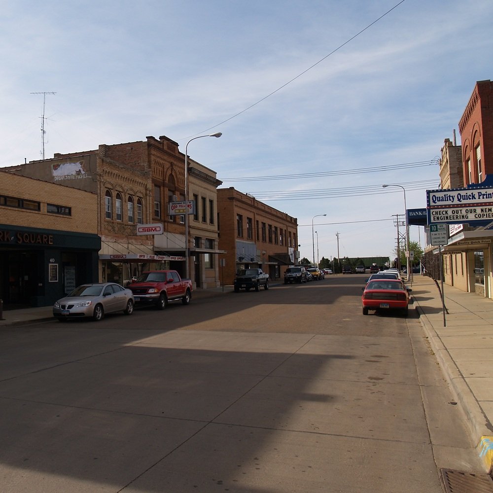 Experienced broker analyzing industrial property data, site access, and development potential maps