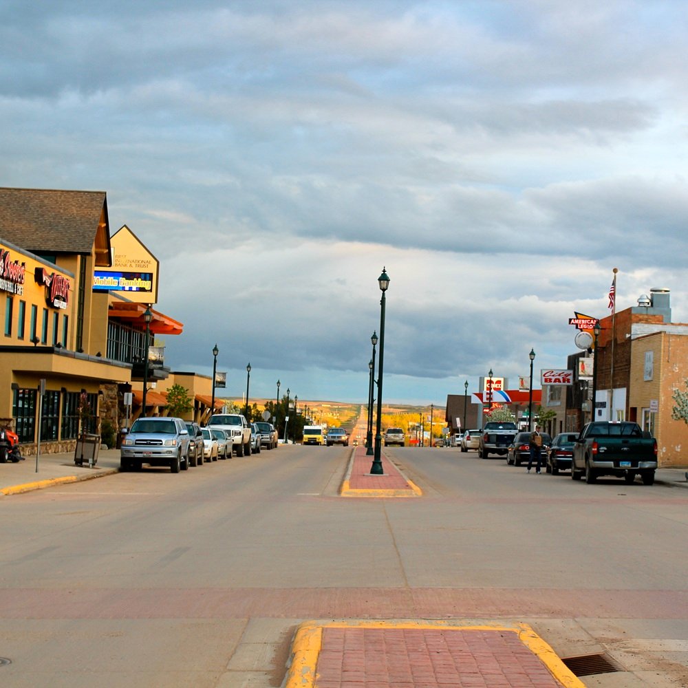 Broker reviewing industrial site maps, utility access, and lease terms with client